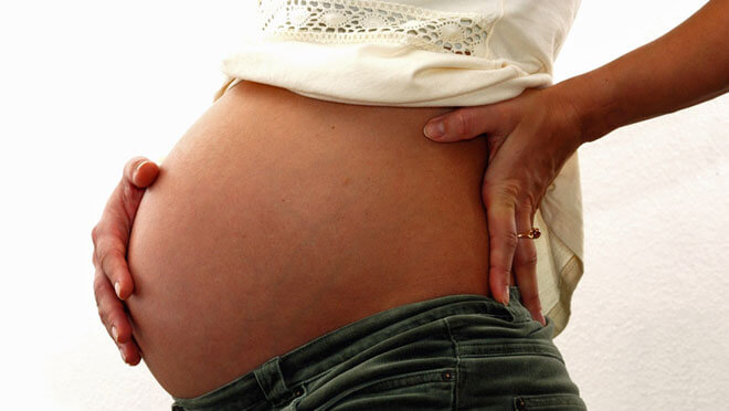 Почему болят почки во время беременности